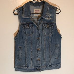 Woman’s distressed denim vest